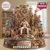 Elvis Presley figurine on a decorative Hawaiian-themed stage with tiki statues, surfboards, elephants, and volcano motifs.!