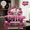 Elvis Presley collectible figure standing next to a pink Cadillac, featuring a Las Vegas sign background and neon accents.!