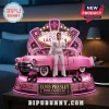 Elvis Presley figure standing before a pink Cadillac with a Las Vegas neon sign backdrop on a circular musical base.!