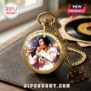 Gold pocket watch with Elvis Presley image, star engravings, and text reading Elvis Presley The King of Rock & Roll.!