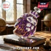 Crystal lion head decanter with purple accents, embossed with EPL 1992-2027 35th Anniversary logo on a vintage book.!