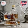 Crown Royal glass decanter shaped like a yellow construction excavator with metal treads and a golden bottle cap.!