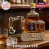 Crown Royal whiskey bottle shaped like an excavator with a clear glass body, gold cap, and purple front label.!
