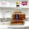 Excavator shaped glass whiskey decanter filled with amber liquid, featuring a Crown Royal label and gold screw cap.!