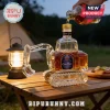 Crown Royal glass liquor decanter shaped like a yellow construction excavator on a wooden table with a camping lantern.!
