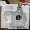 Clear glass Crown Royal whiskey bottle shaped like a construction excavator in a white foam shipping container.!