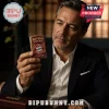 Man holding a gold-toned Zippo lighter featuring the Bayern München soccer club logo, text, and deep red accents.!