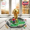 Gold FIFA World Cup 2026 building block trophy model with a soccer minifigure on a green pitch base.!