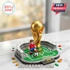 Brick-style FIFA World Cup 2026 gold trophy set with a soccer player minifigure on a green pitch base.!