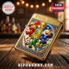Gold Zippo-style metal lighter embossed with FIFA 2026 World Cup graphics, soccer mascots, and a trophy on wooden table.!