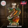 Crystal snake-shaped decanter with green and amber geometric facets, featuring a FAMU engraving and a 140th anniversary tag.!