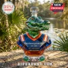 Faceted green alligator glass decanter wearing a blue and orange jersey with text reading Only Gators get out alive.!