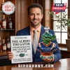 Man holding a crystal alligator-shaped decanter and a sign for the 120th anniversary Albert the Gator whiskey bottle.!