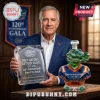Man holding a crystal plaque and a multifaceted glass alligator decanter with orange and blue Florida Gators branding.!
