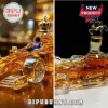 Formula 1 race car shaped glass whiskey decanter filled with amber liquid, featuring a horse stopper and Blanton's branding.!