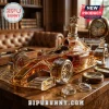 Formula 1 race car shaped glass whiskey decanter with gold horse stopper on a wooden desk with a compass and glasses.!