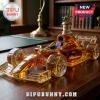 Formula 1 racing car shaped glass decanter filled with amber bourbon featuring a Blanton's horse and jockey stopper.!