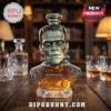Frankenstein 95th Anniversary glass decanter filled with amber liquid on a wooden table with crystal glasses.!