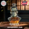 Frankenstein monster bust glass whiskey decanter with 95th Anniversary text on a wooden surface.!
