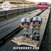 Two Indy 500 Funko Pop racing driver figurines with a Borg-Warner Trophy replica and racing helmet on wooden stadium bleachers.!