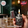 Metal Zippo lighter with Georgia Bulldogs 3D relief emblem, lit flame, smoke, and Go Dawgs text on wooden surface.!