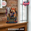 Paris Saint-Germain brick mascot figurine holding a trophy with Eiffel Tower backdrop on a wooden table.!