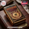 Gold-tone Zippo lighter featuring a black and red relief of the German football crest with the text Deutschland and stars.!