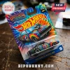 Hot Wheels Grateful Dead 60th anniversary diecast car in tie-dye packaging on a wooden surface.!