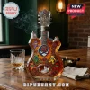 Grateful Dead 60th anniversary guitar-shaped glass whiskey decanter with dancing bears and rose graphics on a wooden table.!