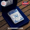 Grey Goose 30th anniversary metal lighter in a blue velvet gift box on a wooden surface.!