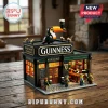 Guinness Irish pub brick model set featuring a toucan on the roof, miniature figures, and warm interior lighting.!