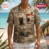 Tan short-sleeve button-down shirt featuring vintage Guinness branding, a toucan, pint glass, barrels, and tropical flowers.!