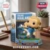 Erling Haaland vinyl figure kicking a soccer ball on a grass-textured base next to its branded display box.!