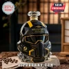 Helldivers 2 B-01 Tactical helmet shaped whiskey decanter in black and yellow glass on a table with coffee beans.!