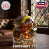 Helldivers 2 helmet glass decanter filled with amber liquid, featuring yellow stripes, skull logo, and engraved base text.!