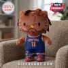 Hello Kitty plush wearing a brown beard, dreadlocks, and a blue New York Knicks jersey with number 11 on a tan armchair.!