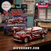 Greased Lightning red Ford De Luxe die-cast model car with white flame decals and blister card packaging on wood desk.!