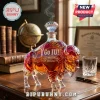 Crystal bison decanter with diamond-shaped stopper, engraved with Go IU 140th Anniversary 1887-2027 text on desk.!