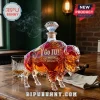 Crystal bison-shaped whiskey decanter with etched Go IU 140th Anniversary 1887-2027 text on a wooden table.!