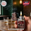 Zippo metal lighter featuring Indiana Hoosiers football graphics, mascot, and logo held in a hand with whiskey glasses.!