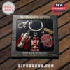 Indianapolis 500 110th anniversary keychain set featuring a trophy, race car, and logo emblem in a black gift box.!