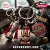 Indy 500 keychain set featuring Borg-Warner trophy, red race car, and 110th running shield on a metal ring.!
