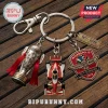 Indy 500 keychain featuring a Borg-Warner trophy, race car, and 110th anniversary badge on a silver metal keyring.!