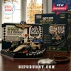 Indy 500 building block set featuring a tan race car, victory trophy, crew minifigures, and a dark blue display backdrop.!