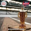 Indy 500 110th anniversary trophy-shaped glass whiskey bottle on vintage luggage at a racetrack background.!