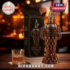 Indy 500 110th anniversary trophy-shaped whiskey bottle and matching box with a checkered flag topper on a wooden table.!