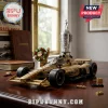 Gold IndyCar racing brick model with driver figurine, floral wreath, and silver trophy on a polished wooden desk.!
