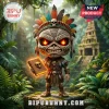 Vinyl figure of a tribal skull character with feather headdress, glowing red eyes, and a magical tome in jungle setting.!