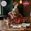 Iron Maiden The Trooper crystal decanter featuring Eddie the mascot in a red British soldier uniform on a wooden table.!