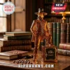 Amber glass decanter shaped like a 19th-century gentleman resting a foot on a square safe marked 160th on a wooden desk.!
